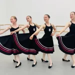 Royal Academy of Dance Exam Success 2025 - 4 young dancers with skirts